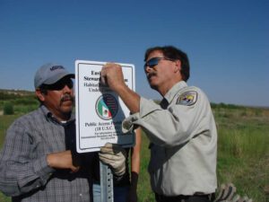 IBWC and USFWS staff posting environmental stewardship program sign, September 2012